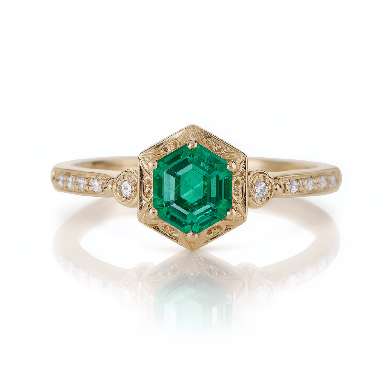 Gold ring with a green gemstone and diamond accents on a white background