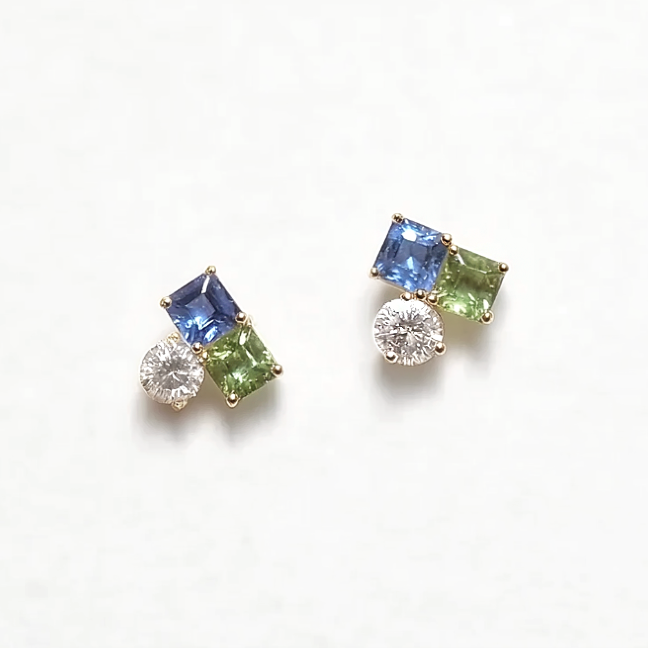 Pair of earrings with gemstones on a white background