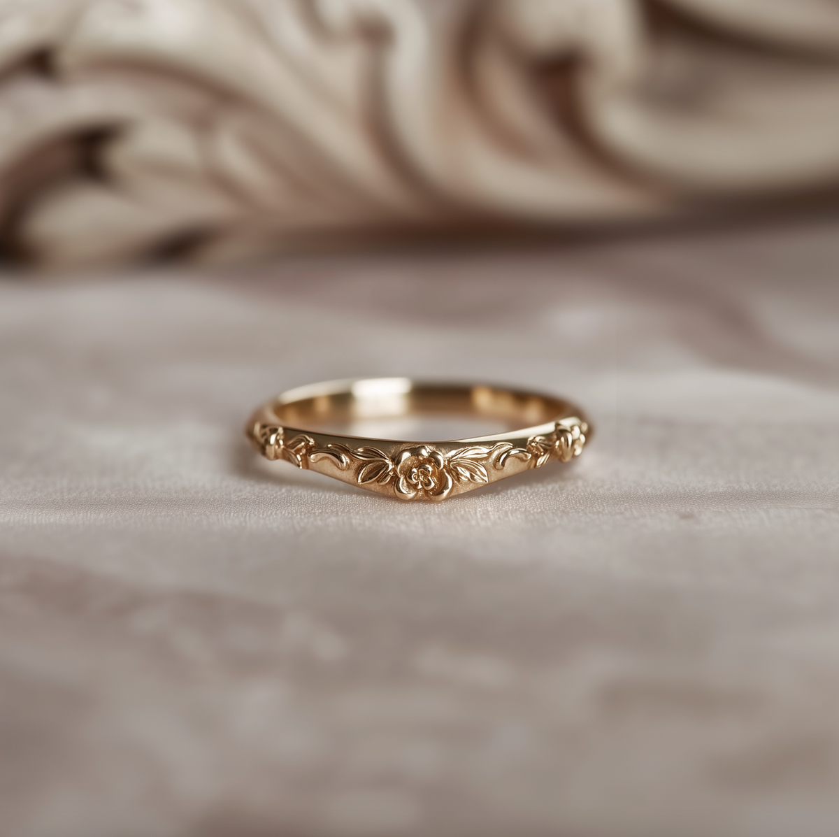 Botanical gold wedding band stacked with a diamond engagement ring
