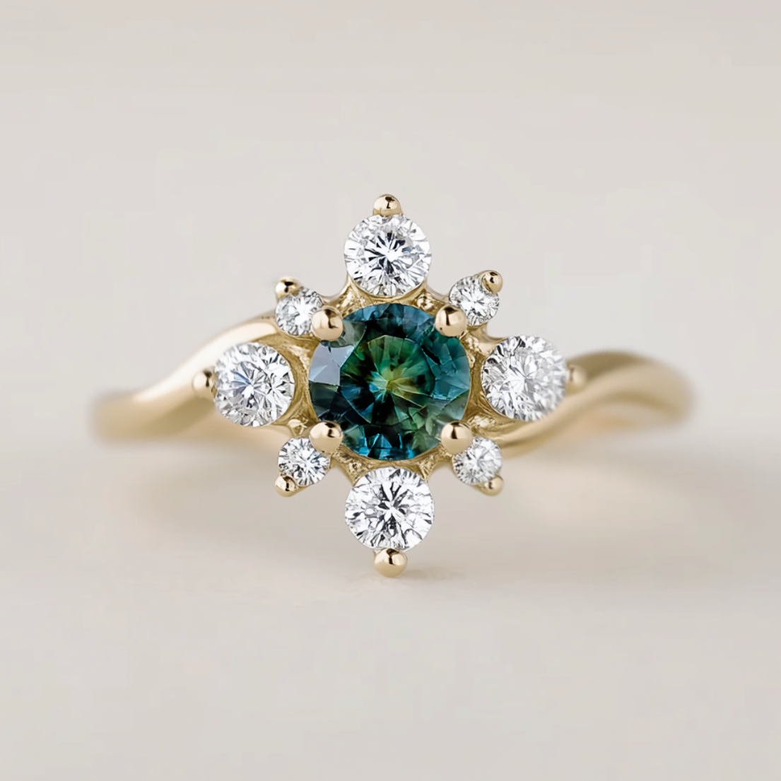 Gold ring with a green gemstone and white diamonds on a light background