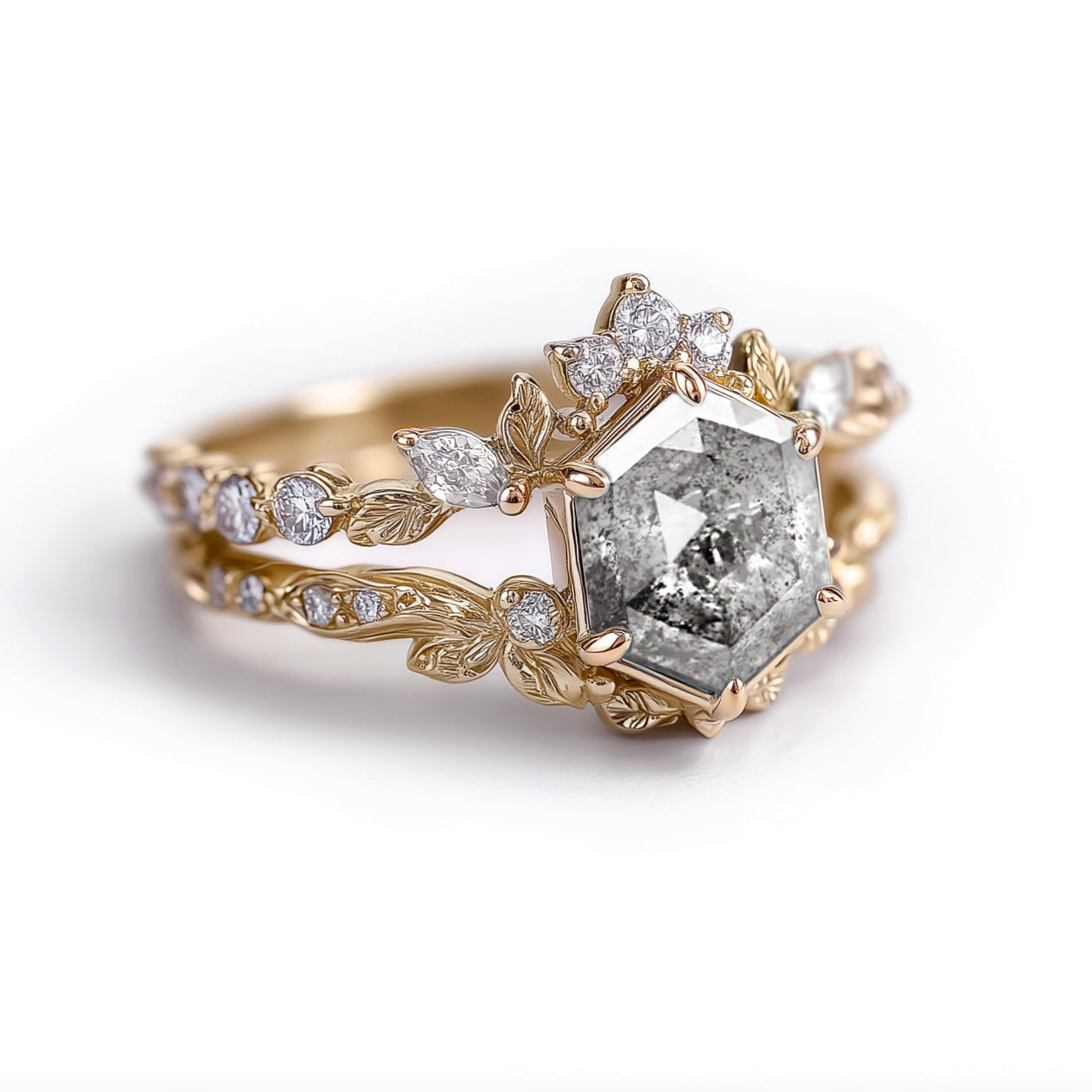 Gold ring with a large diamond and smaller diamonds on a white background