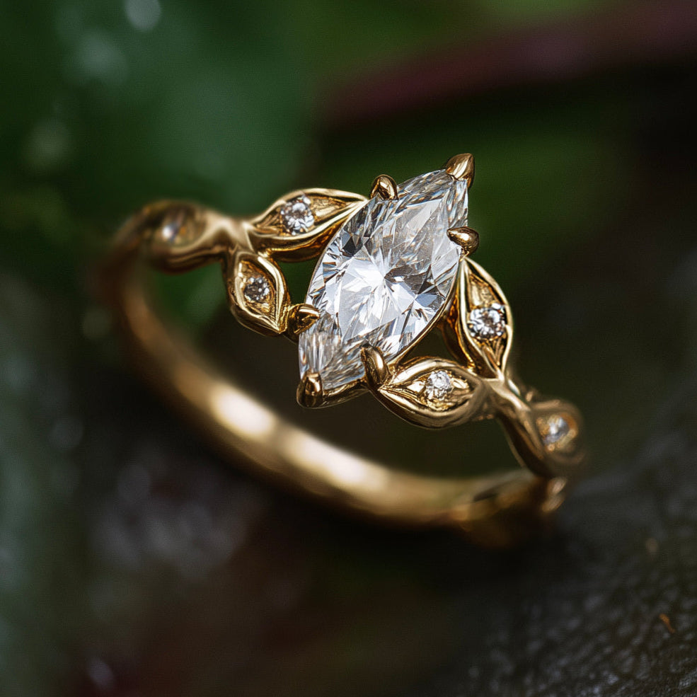 Gold ring with a marquise-shaped diamond on a dark background