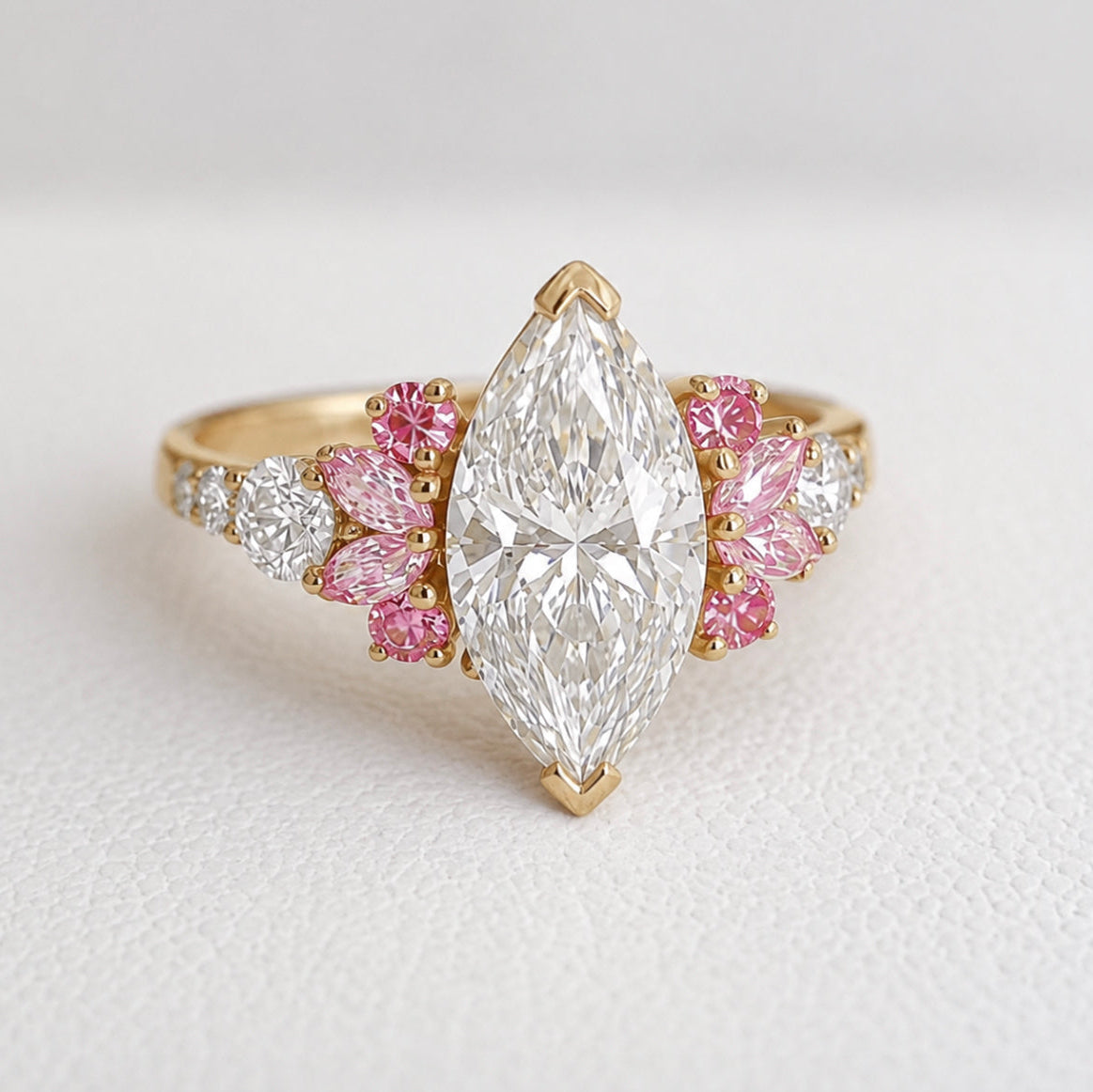 Elegant ring with a large central diamond and smaller pink and white diamonds on a light background