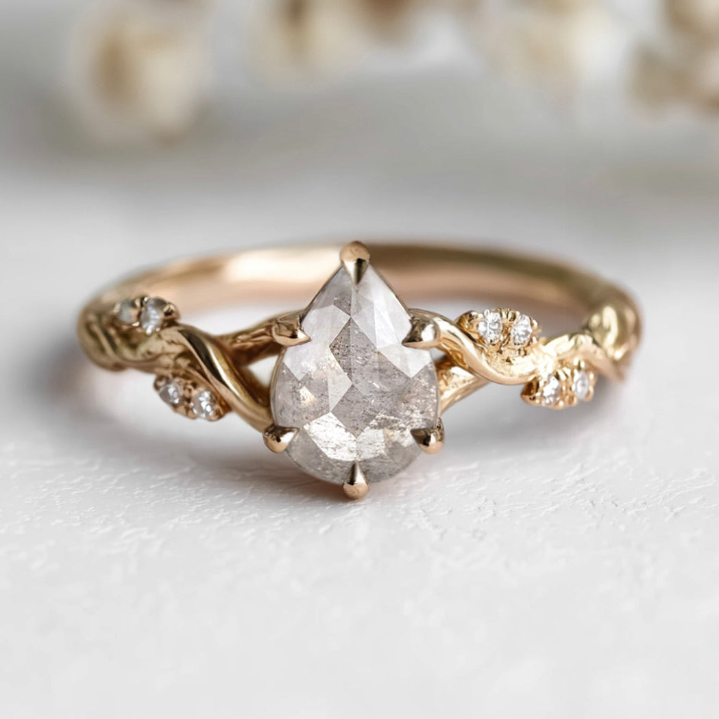 Gold ring with a diamond on a light background